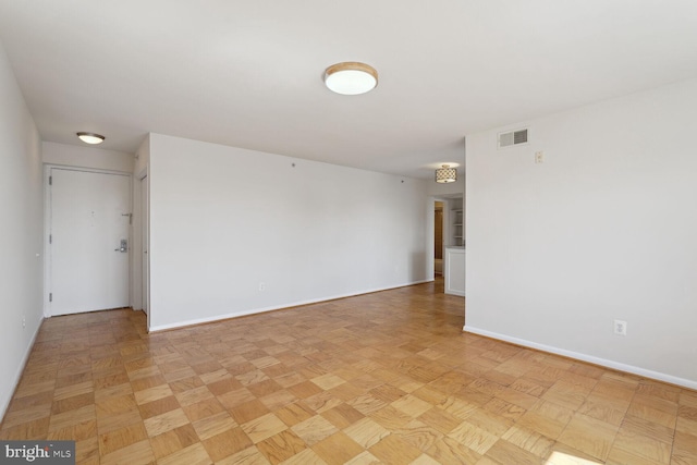 unfurnished room featuring light parquet floors