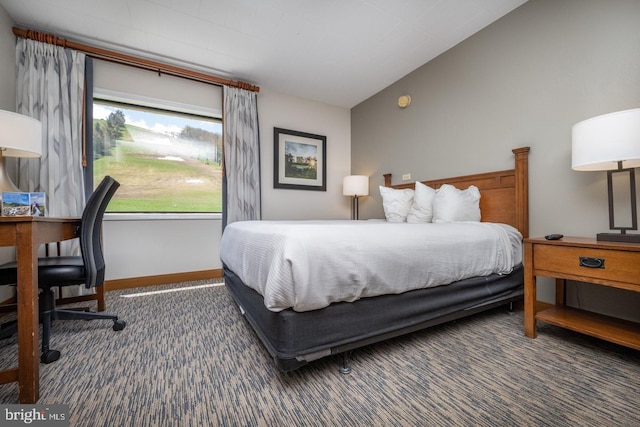 carpeted bedroom with vaulted ceiling