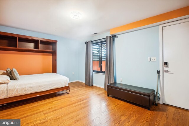 bedroom with light hardwood / wood-style flooring