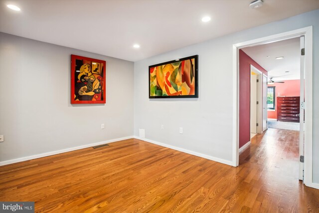 unfurnished room with wood-type flooring