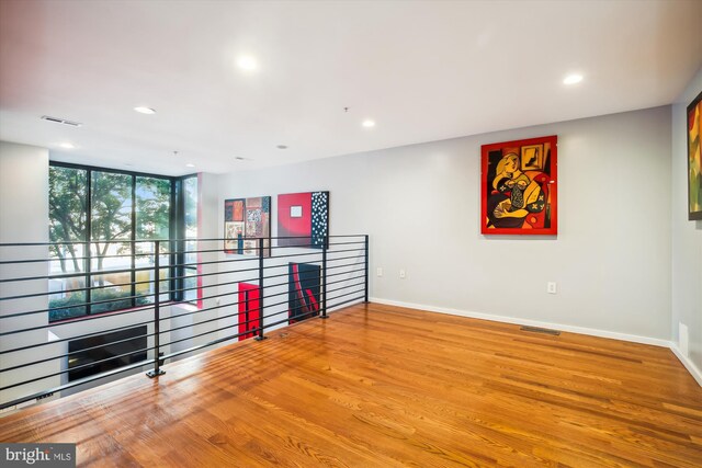 spare room featuring hardwood / wood-style flooring