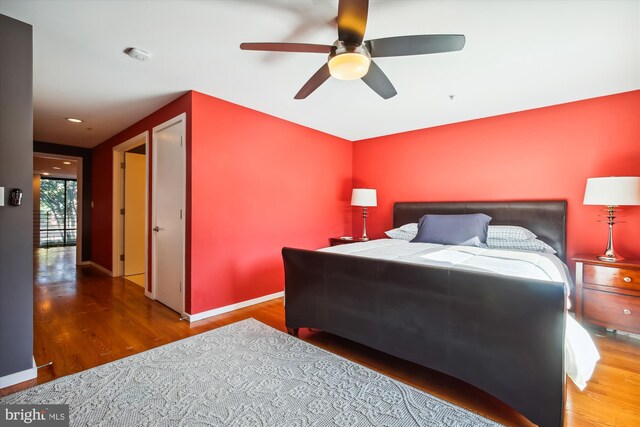 bedroom featuring wood-type flooring and ceiling fan