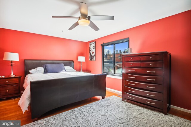 bedroom featuring ceiling fan and hardwood / wood-style flooring