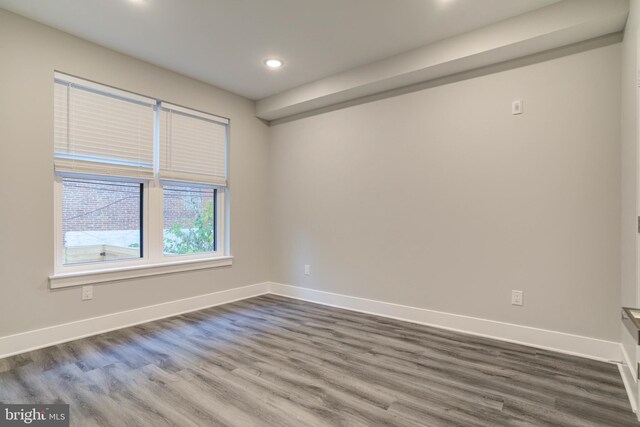 empty room featuring hardwood / wood-style flooring