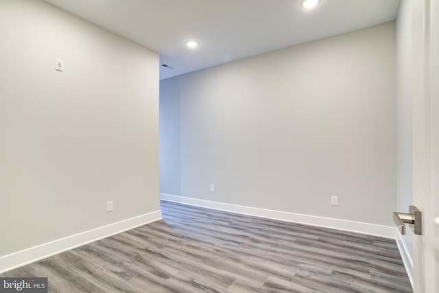 empty room with wood-type flooring