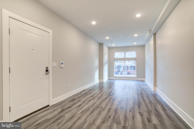 spare room with wood-type flooring