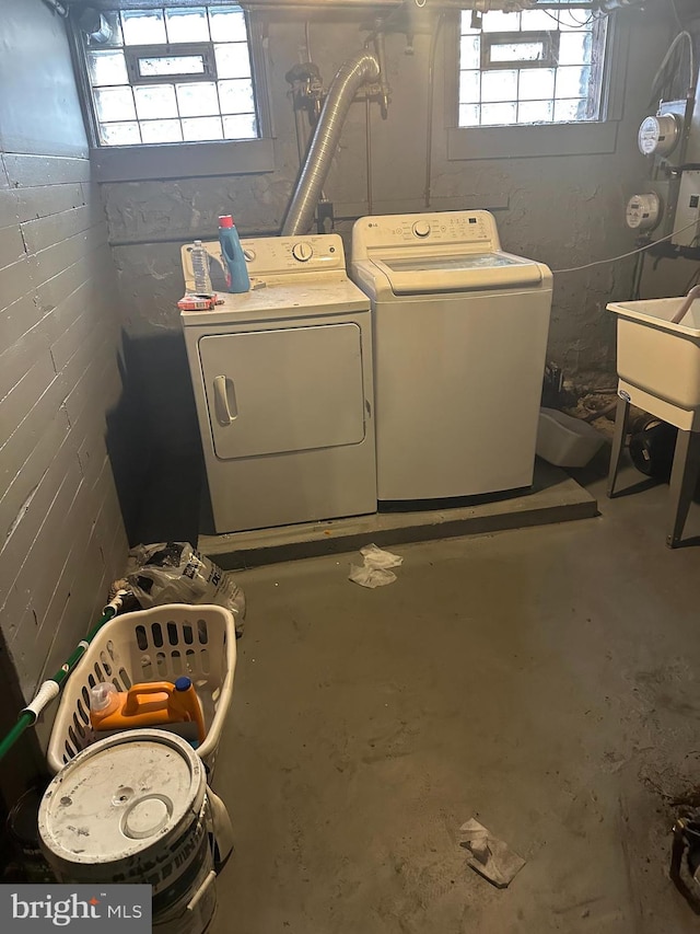 washroom featuring separate washer and dryer