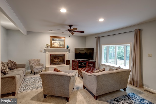 carpeted living room featuring ceiling fan