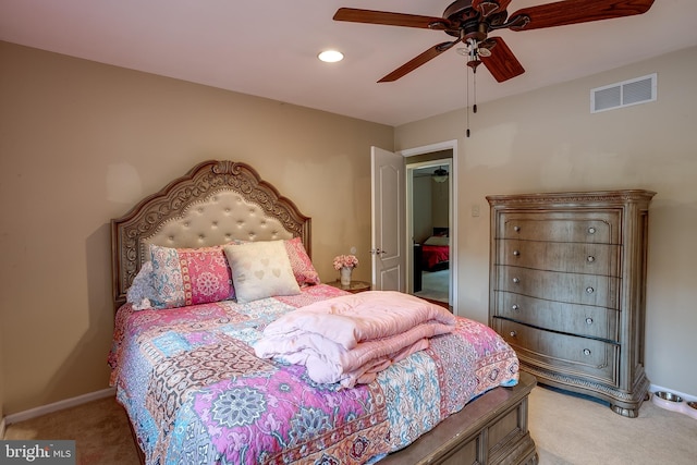 carpeted bedroom featuring ceiling fan