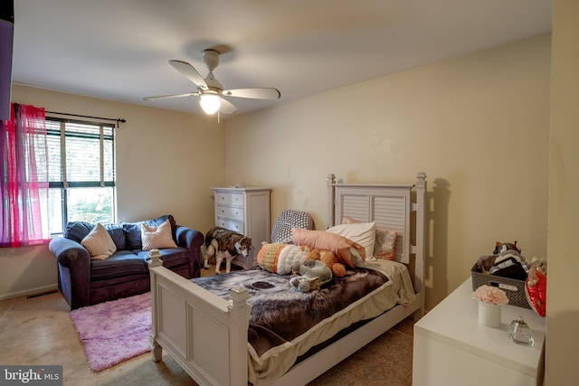 bedroom featuring ceiling fan and light colored carpet