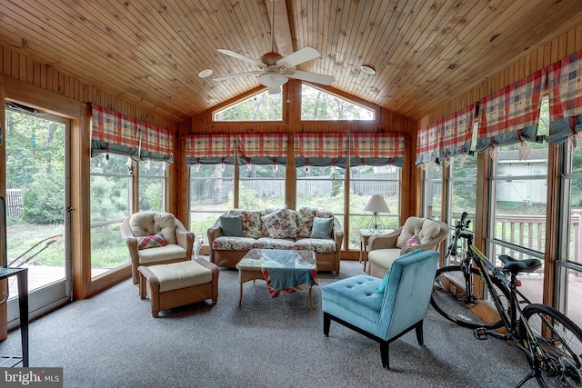 sunroom with lofted ceiling, wooden ceiling, and ceiling fan