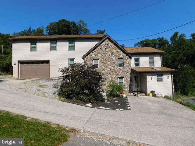 front of property with a garage