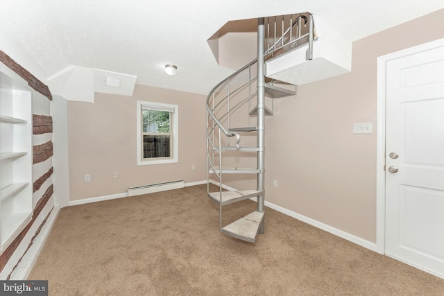 staircase with a baseboard radiator and carpet