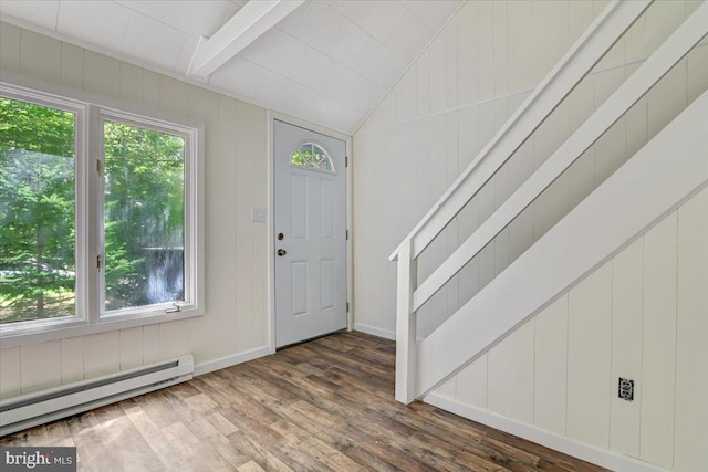 entryway featuring a wealth of natural light, lofted ceiling with beams, dark wood-type flooring, and a baseboard radiator