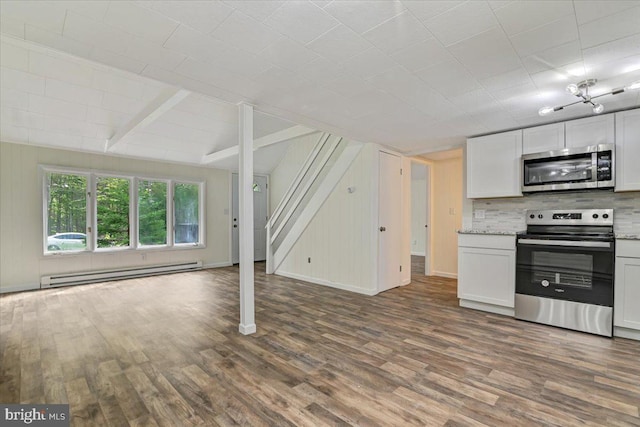 kitchen featuring appliances with stainless steel finishes, tasteful backsplash, a baseboard radiator, dark hardwood / wood-style floors, and white cabinetry