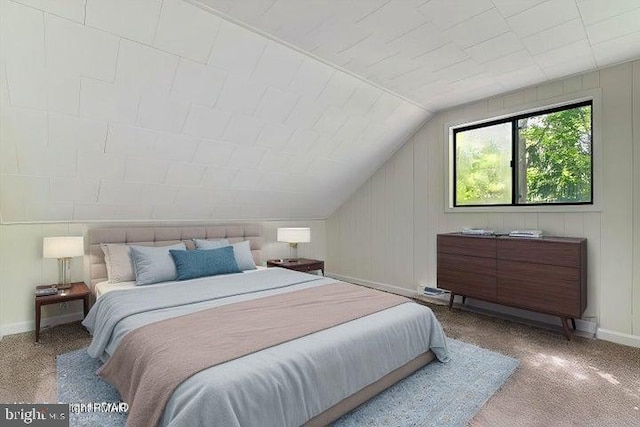 bedroom featuring light colored carpet and lofted ceiling