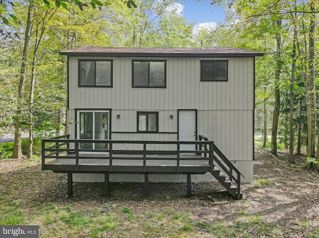 back of house with a wooden deck