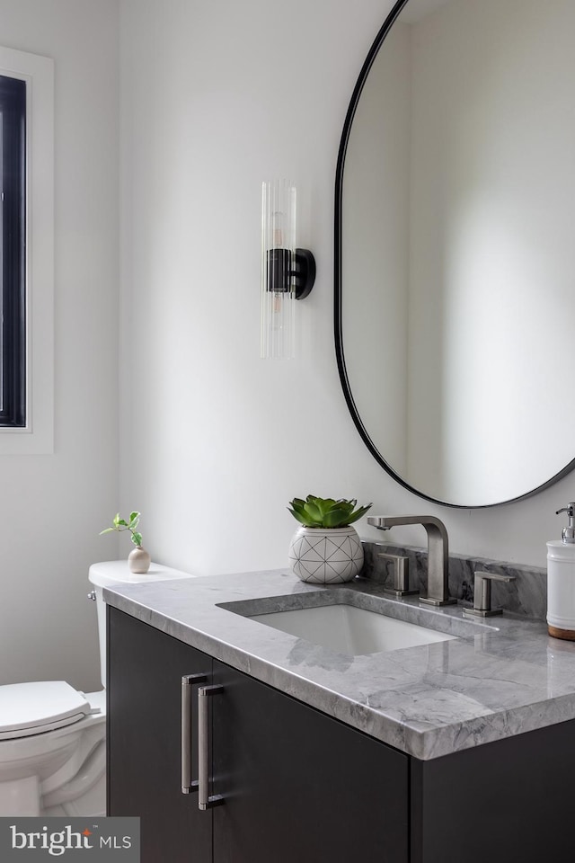 bathroom with vanity and toilet