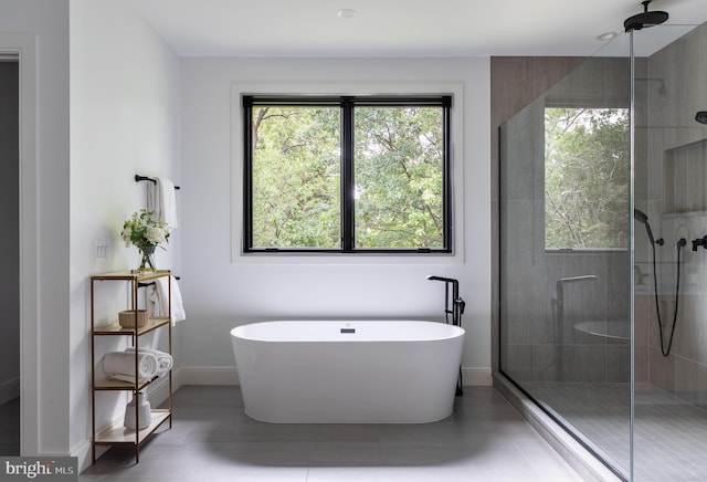 bathroom featuring tile patterned floors and plus walk in shower