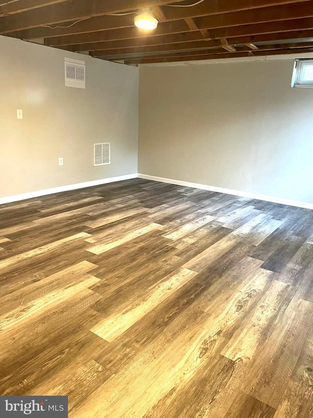 basement with wood-type flooring