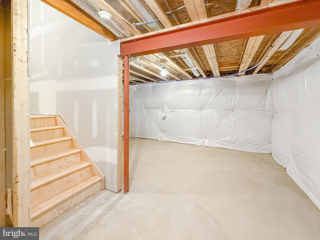 unfinished basement with stairs