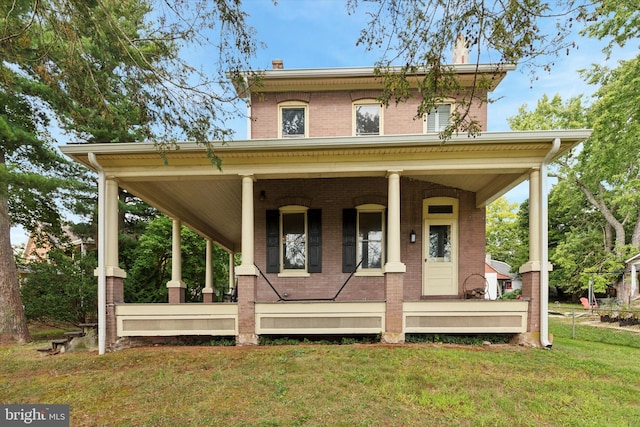 italianate house with a front yard and covered porch