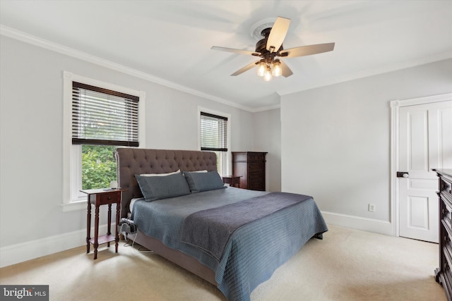 bedroom featuring light carpet, crown molding, and ceiling fan