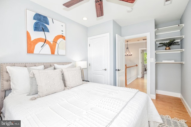 bedroom featuring light hardwood / wood-style floors and ceiling fan