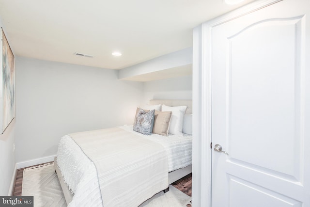 bedroom with hardwood / wood-style flooring