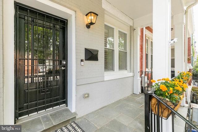 property entrance with covered porch