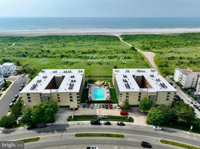 bird's eye view featuring a beach view and a water view