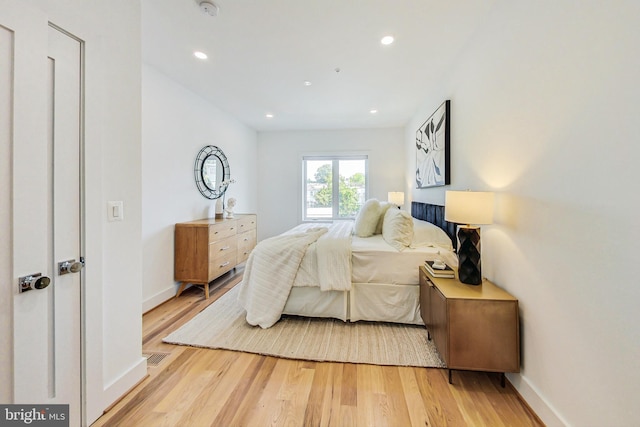 bedroom with light hardwood / wood-style flooring