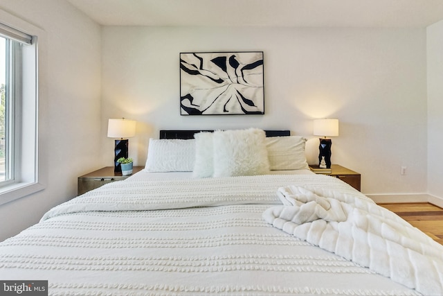 bedroom with hardwood / wood-style floors