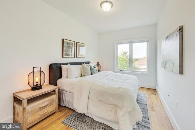 bedroom with light hardwood / wood-style floors