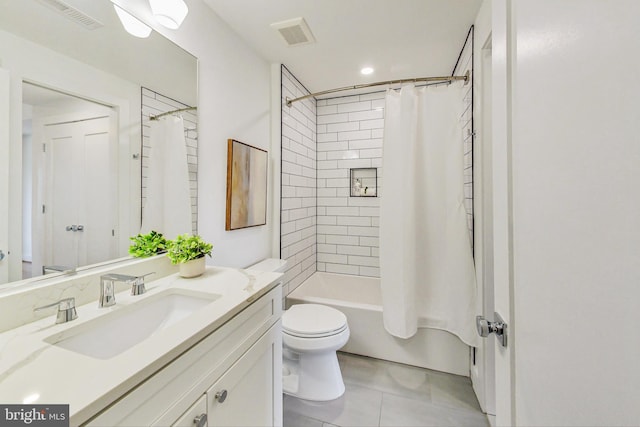 full bathroom with vanity, tile patterned floors, toilet, and shower / bath combo