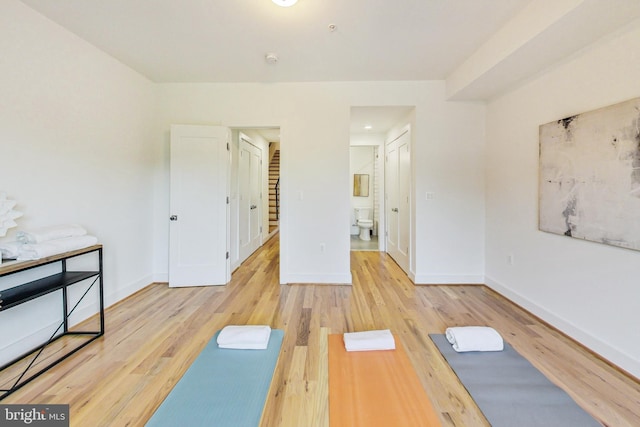 workout room featuring light hardwood / wood-style floors