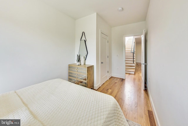 bedroom with light hardwood / wood-style floors