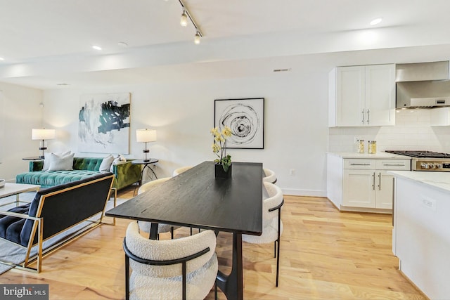 dining area with light hardwood / wood-style flooring