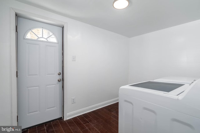 clothes washing area featuring separate washer and dryer and dark hardwood / wood-style flooring