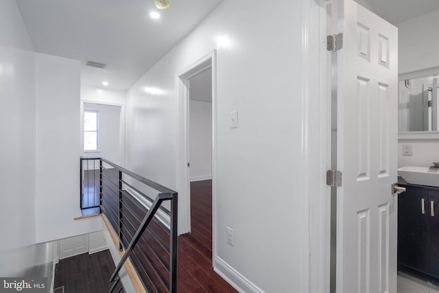 hall with dark hardwood / wood-style flooring