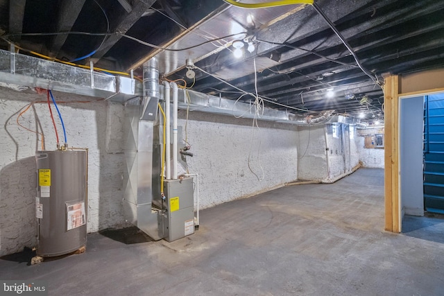 basement with heating unit and electric water heater