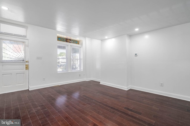 foyer entrance featuring dark hardwood / wood-style floors