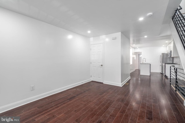 interior space featuring dark hardwood / wood-style flooring and sink