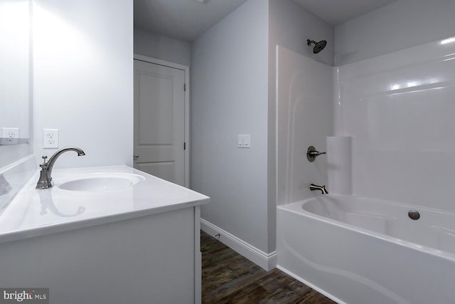 bathroom featuring shower / tub combination, vanity, and hardwood / wood-style floors