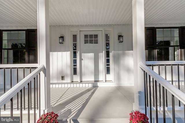 doorway to property featuring covered porch