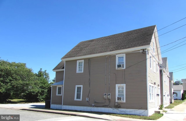 view of side of property featuring cooling unit