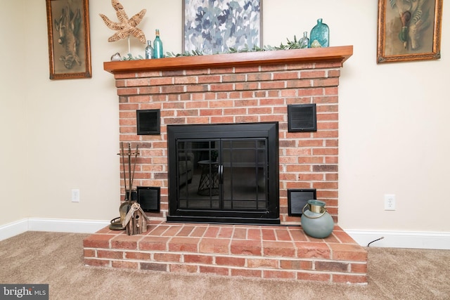 room details featuring a fireplace and carpet floors