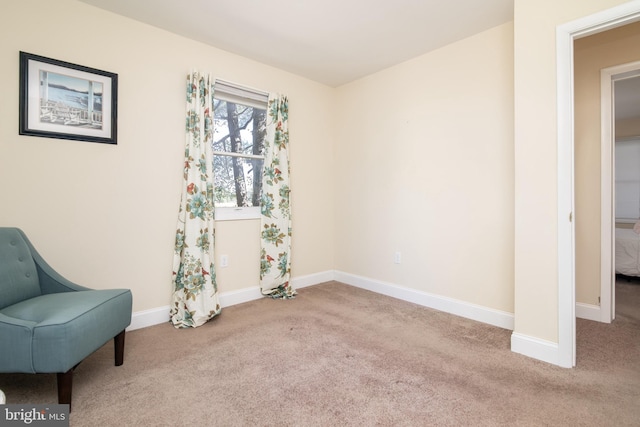 sitting room with light colored carpet