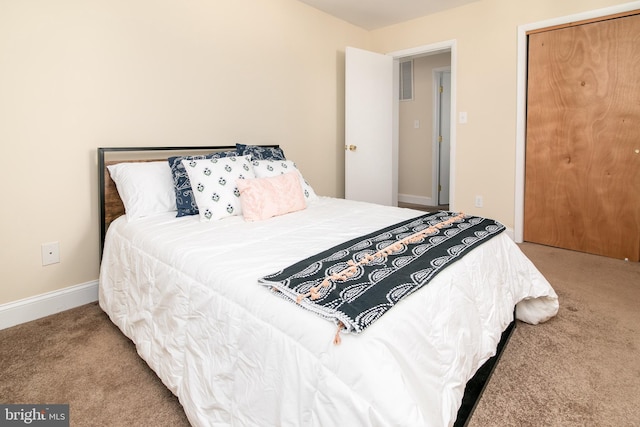 carpeted bedroom featuring a closet