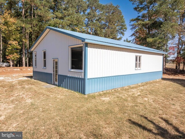 view of property exterior featuring a yard